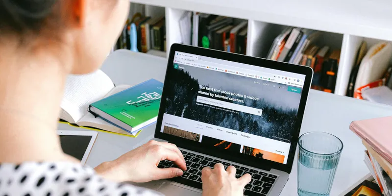 UX study: a participant tests a website on a laptop