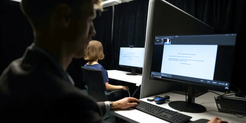 A researcher at a computer runs a supervised research session